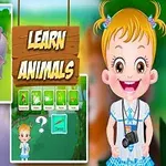 Egy rajzfilmes kislány mosolyogva áll, kezében fényképezőgép, háttérben egy dzsungeljelenet látható, állatokkal és Learn Animals felirattal
