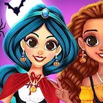 Két fiatal nő áll egymás mellett színes jelmezben, mosolyogva, Halloween dekorációval a háttérben