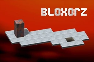 Egy téglalap alakú oszlop lebeg egy szürke kockákból álló, narancssárga háttér előtti platformon, mellette egy lyuk látható