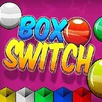 Színes gömbök és Box Switch felirat rózsaszín háttérrel, alul színes dobozokkal