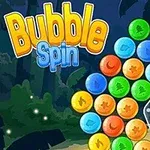 Színes, különböző mintázatú buborékokkal teli forgó alakzat, sárga csillaggal a közepén, erdős háttérrel és Bubble Spin felirattal