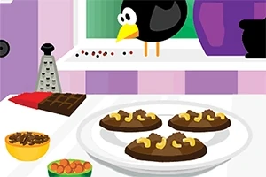 A képen négy csokis sütemény látható egy tányéron, háttérben egy ablak előtt egy fekete madár, egy reszelő, fűszerek, és csokoládé
