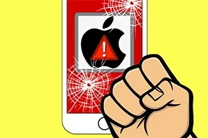 Ököllel összetört iPhone képernyő, amelyen egy piros figyelmeztető jel és egy Apple logó látható