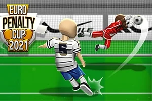 Egy focista fehér mezben rúgja a labdát a kapu felé, miközben a kapus piros mezben vetődik a labda irányába