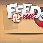 A képen egy piros gömb alakú karakter látható, nagy szemekkel és egy bekapni készülő cukorkával, mellette a Feed me felirat szerepel
