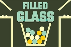 Filled Glass felirat, színes golyókkal teli pohár egy sötét háttér előtt