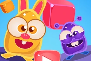 Két színes, rajzfilmszerű, vidám lény, egy sárga nyusziszerű figura és egy lila antennás lény, színes kockák között lebegnek kék háttér előtt