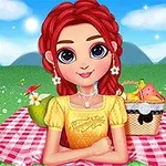 Piknikező lány piros hajjal és sárga ruhában, piknikkosárral egy zöld réten, kockás pokrócon ülve