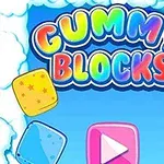 Színes betűkkel írt Gummy Blocks felirat felhők között és körülötte cukorkaformák