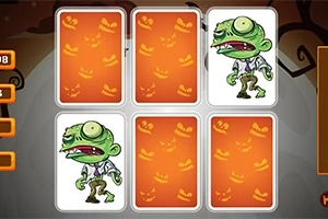 Kártyalapok hátoldalai narancssárga Halloween-mintával, két felfordított lapon zombi rajza látható