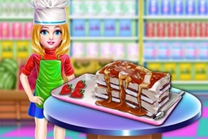 Fiatal lány szakácsruhában egy asztalnál áll, rajta tejszínes torta karamellöntettel és eperrel díszítve