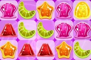 Színes zselés édességek geometriai formákba rendezve egy lila háttéren