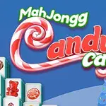 Színes grafikán cukorka motívumokkal körülvett téli táj házakkal és MahJongg felirat