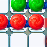 Marble Puzzle Quest Zöld és piros, spirálmintás golyók egy négyzetrácsos mintázaton