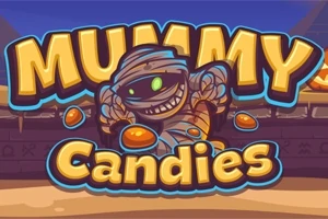 Egy mosolygó, pólyába tekert múmia színes cukorkákkal a sivatagi háttér előtt, a MUMMY Candies felirat alatt