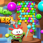 Rajzfilmfigura mosolyog egy színes golyókkal teli tornyot ábrázoló háttér előtt, mellette a Om Nom Tower 3D felirat