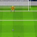 Egy futballjátékos piros mezben áll a kapu előtt zöld füves pályán, készen a tizenegyes rúgásra, miközben a kapus sárga mezben védi a kaput