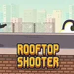 Két pixelart figura áll szemben egymással egy tetőn, az egyik puskával, a másik lila ruhában rakétavetővel, háttérben városképpel és „ROOFTOP SHOOTER” felirattal