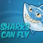Rajzfilmszerű cápa vigyorogva lebeg egy kék háttér előtt, mellette a Sharks Can Fly felirat látható