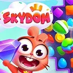 Rajzfilmszerű figura mosolyog, egy nagy lila drágakövet tartva, színes édességek és robbanó cukorka kíséretében