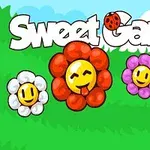 Négy mosolygós virág színes szirmokkal zöld fűben, kék égbolttal a háttérben, Sweet Garden felirattal