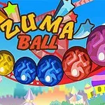 Színes, csillagmintás golyók sorozata egy vidámpark háttérrel, a Zuma Ball felirattal a középpontban
